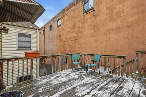 a balcony with wooden floor