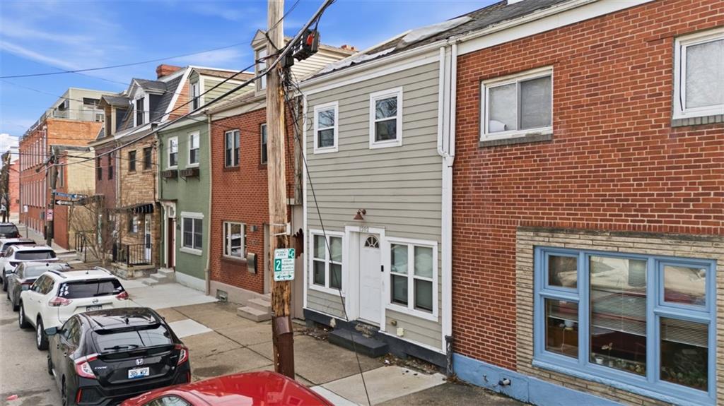 1202 Sarah Street Pittsburgh, PA 15203 - Photo 2 of 39 a view of a brick building with many windows