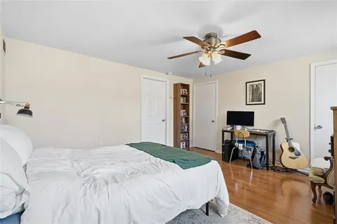 a bedroom with a bed and a table in it