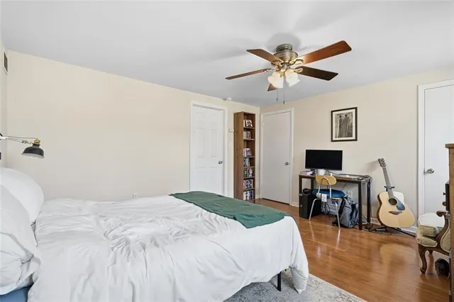 a bedroom with a bed and a table in it