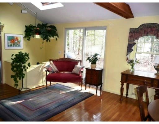21 Leigh Road Wenham, MA 01984 - Photo 3 of 8 a living room with furniture and a potted plant