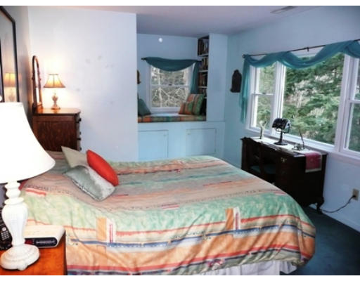 21 Leigh Road Wenham, MA 01984 - Photo 8 of 8 a bedroom with a bed and wooden floor
