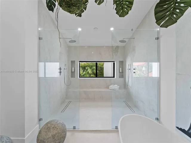 a bathroom with a bathtub and window