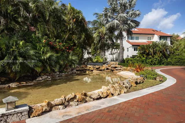 a view of a swimming pool with an outdoor space and seating area