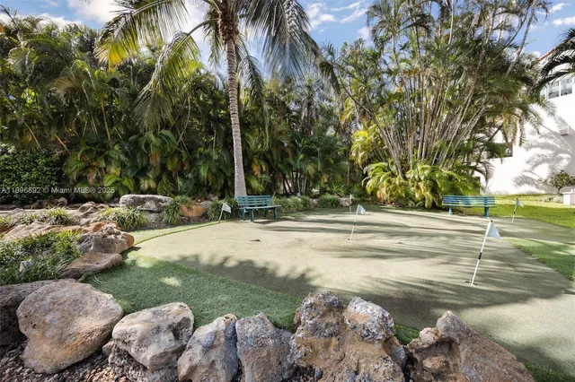 a view of swimming pool with a yard