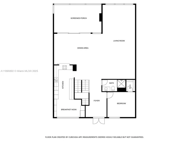 a view of living room with a table and white walls