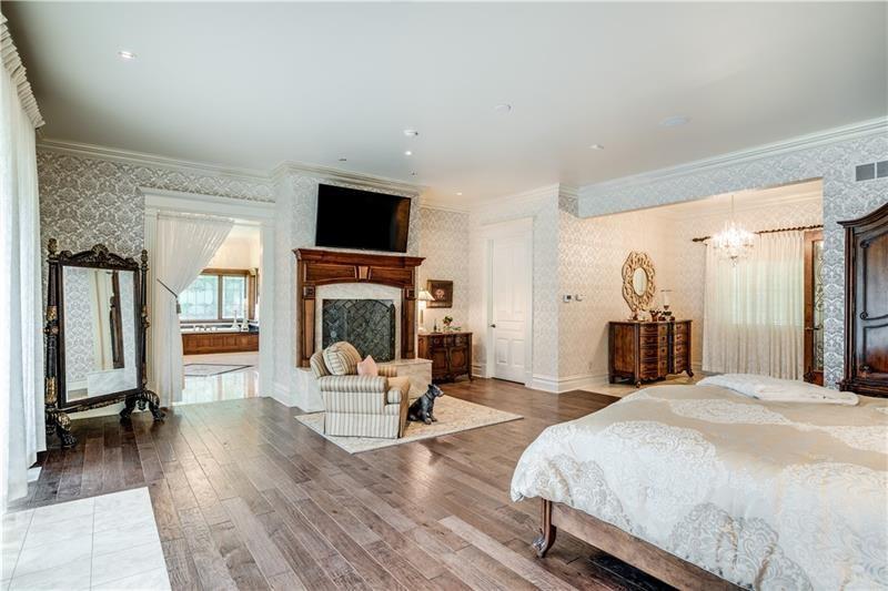 399 Cornetti Road Fenelton, PA 16034 - Photo 15 of 25 a spacious bedroom with a balcony a bed and a flat screen tv