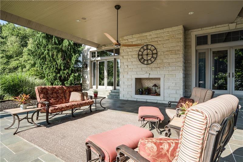 399 Cornetti Road Fenelton, PA 16034 - Photo 19 of 25 a outdoor living space with furniture and a fireplace