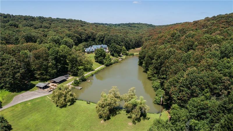 399 Cornetti Road Fenelton, PA 16034 - Photo 20 of 25 an aerial view of green landscape with trees houses and mountain view