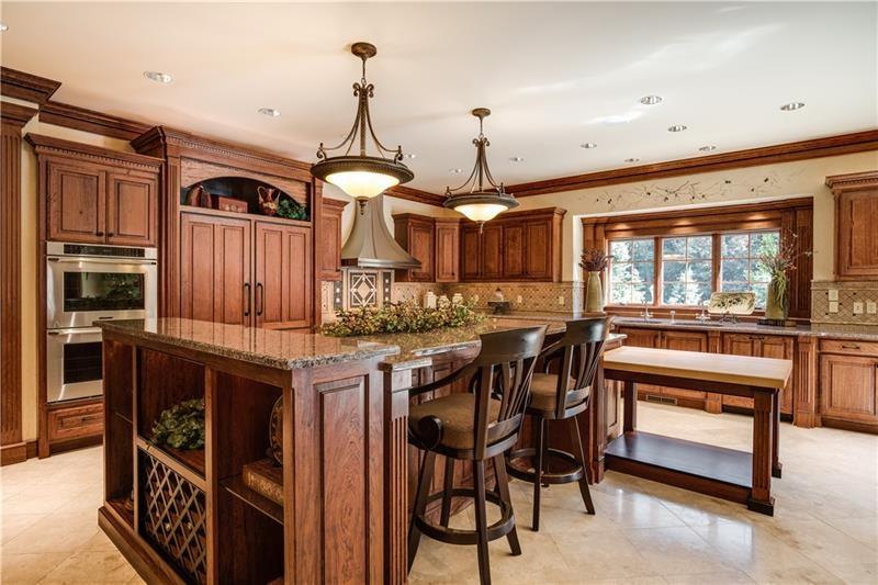 399 Cornetti Road Fenelton, PA 16034 - Photo 9 of 25 a kitchen with stainless steel appliances granite countertop a stove and a refrigerator