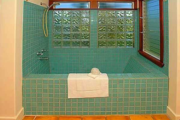 7463 B Koolau Road Kilauea, HI 96754 - Photo 11 of 21 a bathroom with a sink mirror and shower