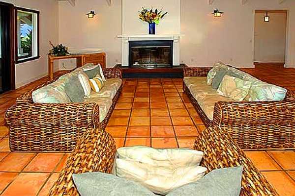 7463 B Koolau Road Kilauea, HI 96754 - Photo 2 of 21 a bedroom with a bed and a fireplace
