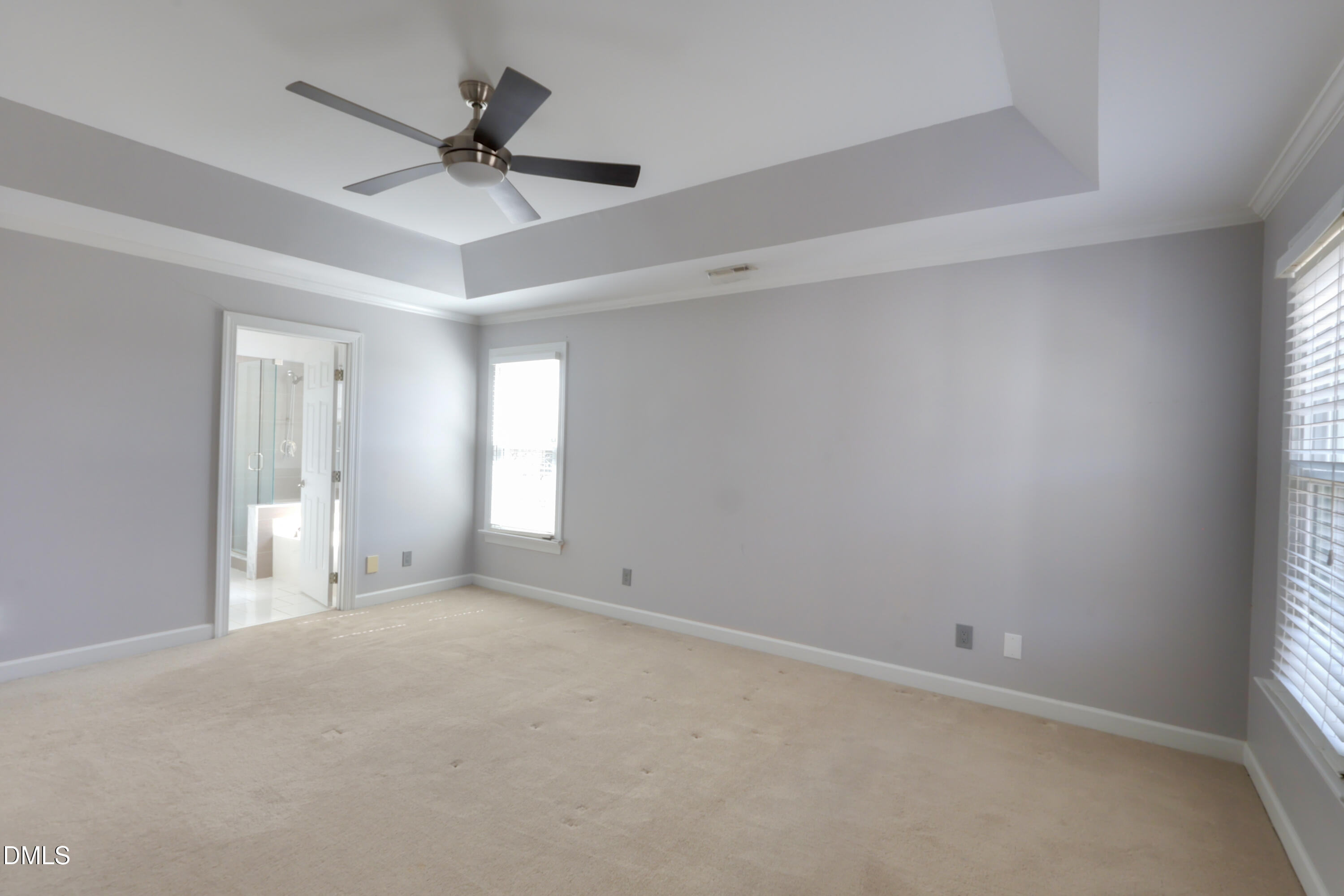2504 Pennyshire Lane Raleigh, NC 27606 - Photo 15 of 32 an empty room with a window and a fan