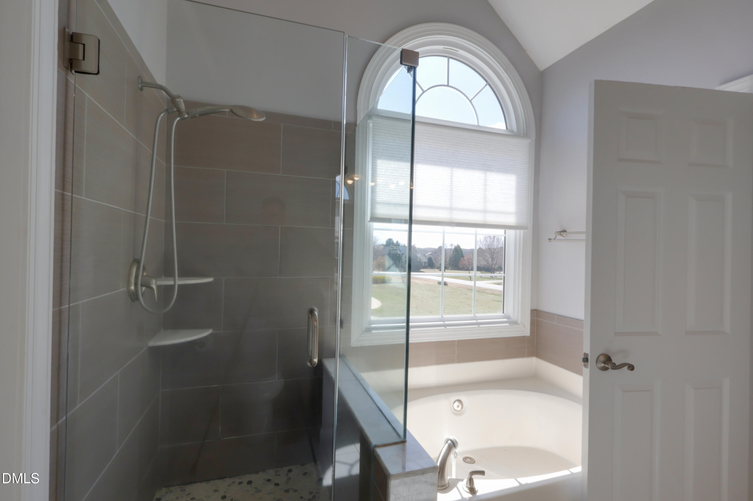 2504 Pennyshire Lane Raleigh, NC 27606 - Photo 16 of 32 a bathroom with a granite countertop bathtub shower and sink