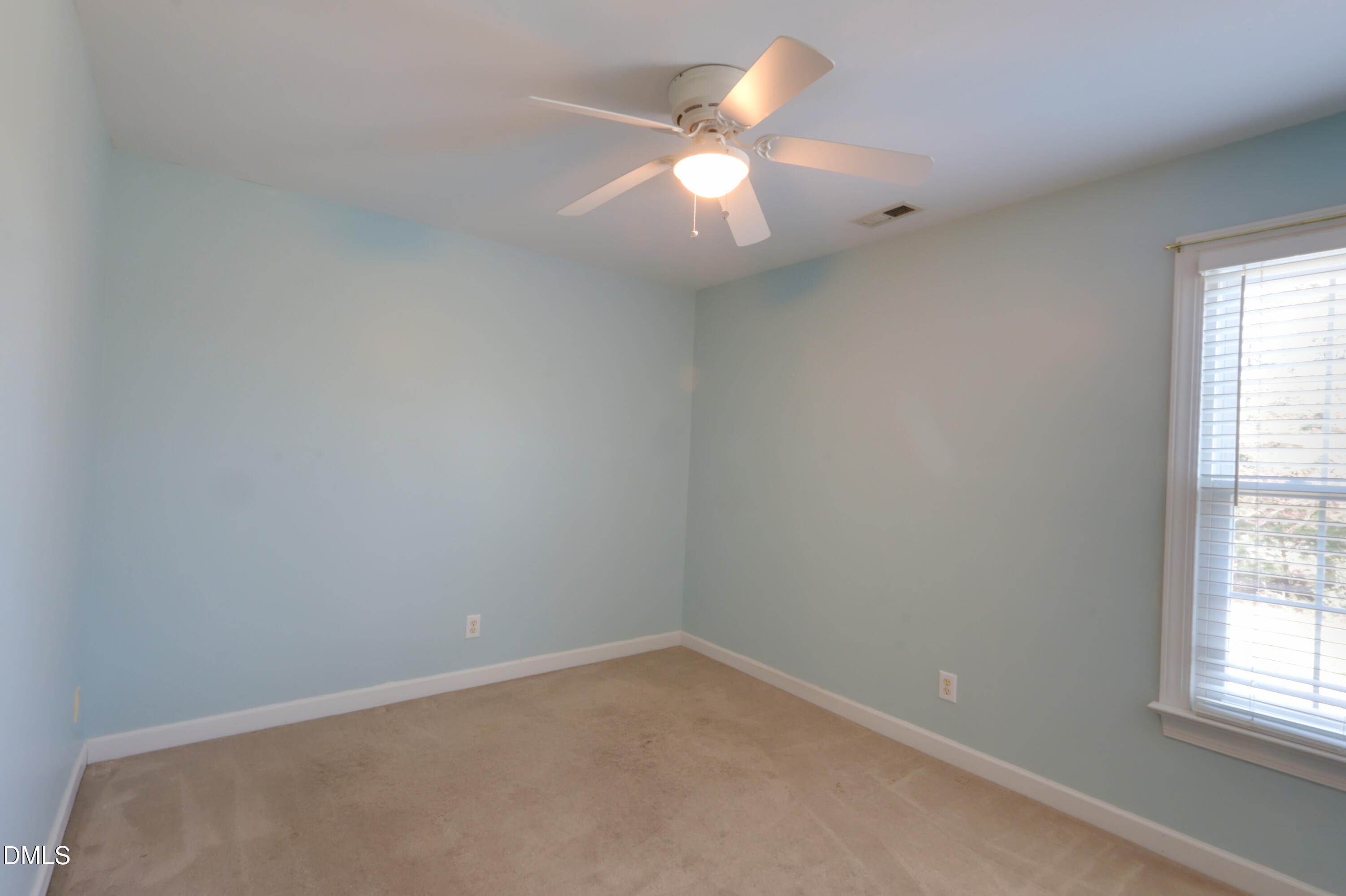 2504 Pennyshire Lane Raleigh, NC 27606 - Photo 19 of 32 an empty room with a window