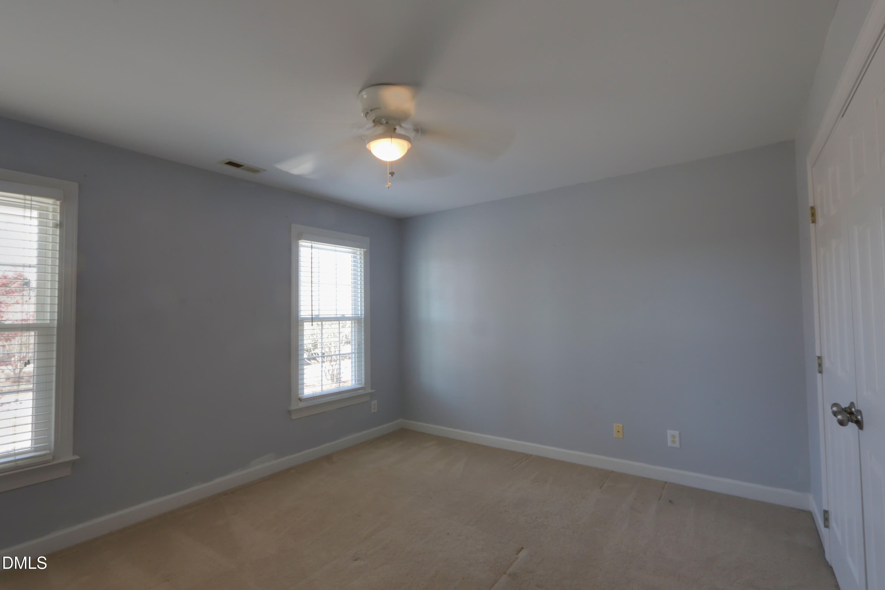 2504 Pennyshire Lane Raleigh, NC 27606 - Photo 20 of 32 an empty room with windows and closet