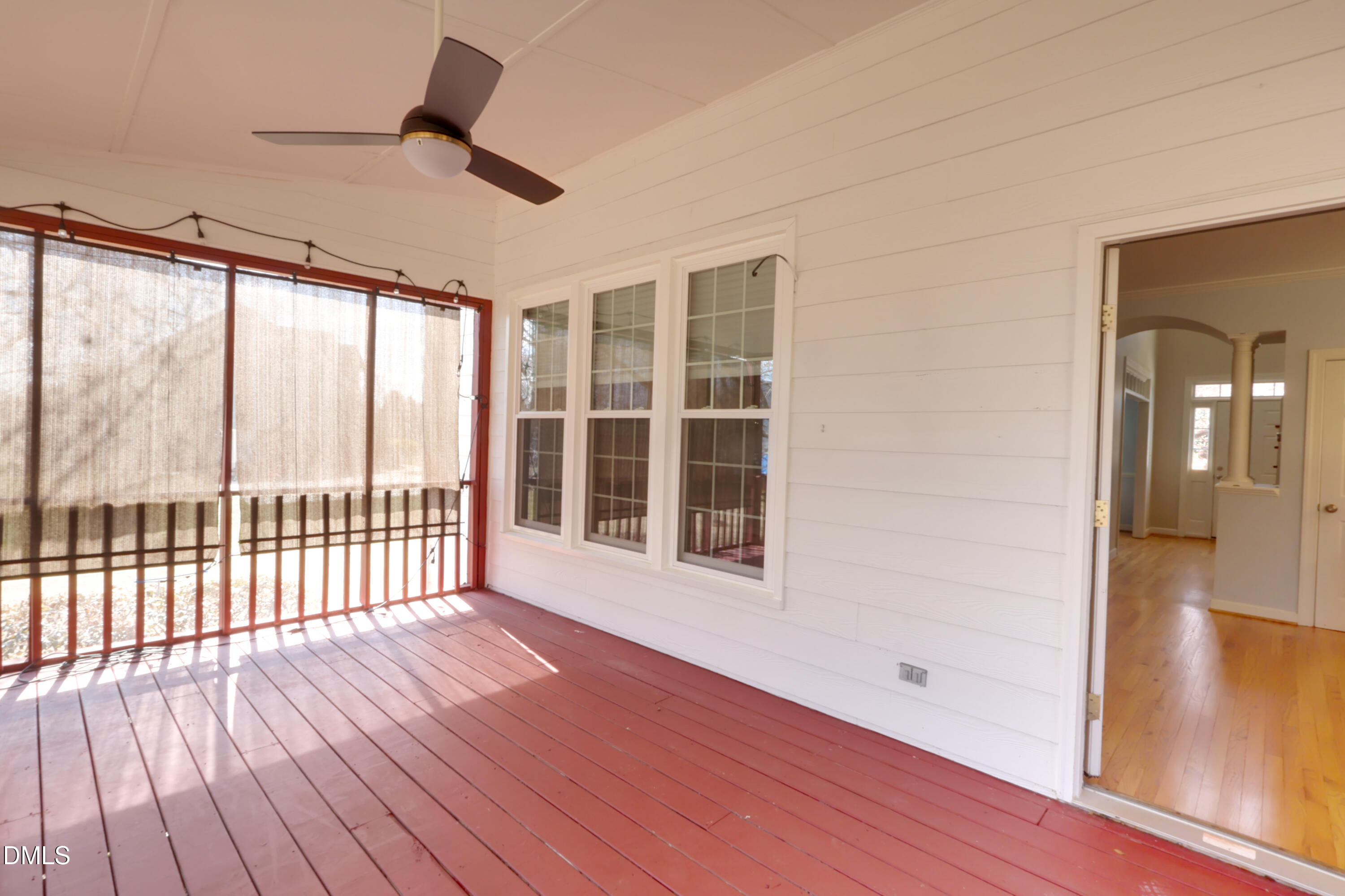 2504 Pennyshire Lane Raleigh, NC 27606 - Photo 24 of 32 a view of an empty room with wooden floor and a window