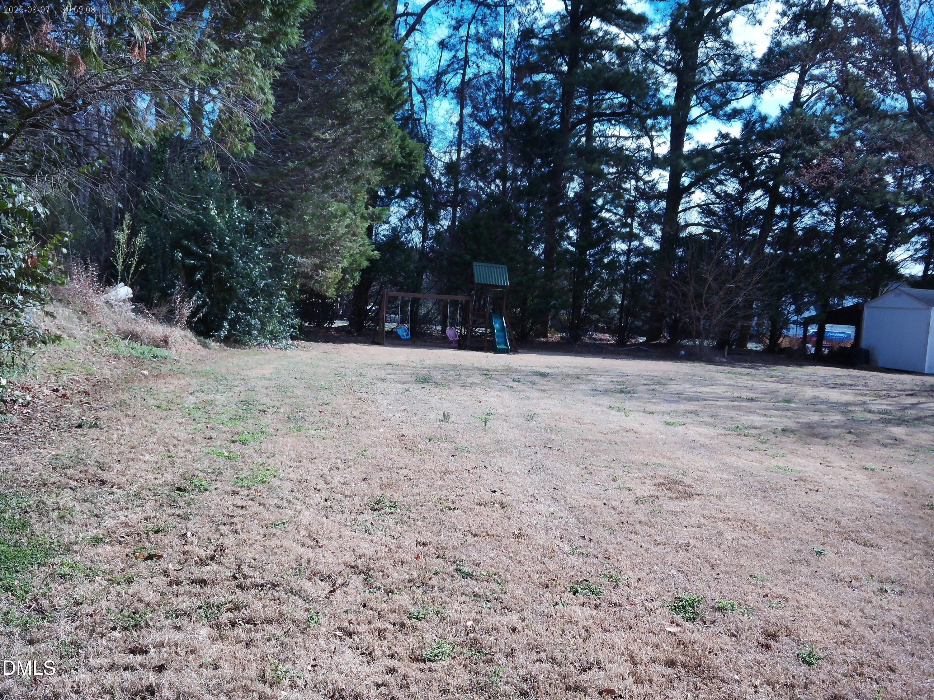 2504 Pennyshire Lane Raleigh, NC 27606 - Photo 28 of 32 a house with trees in front of it