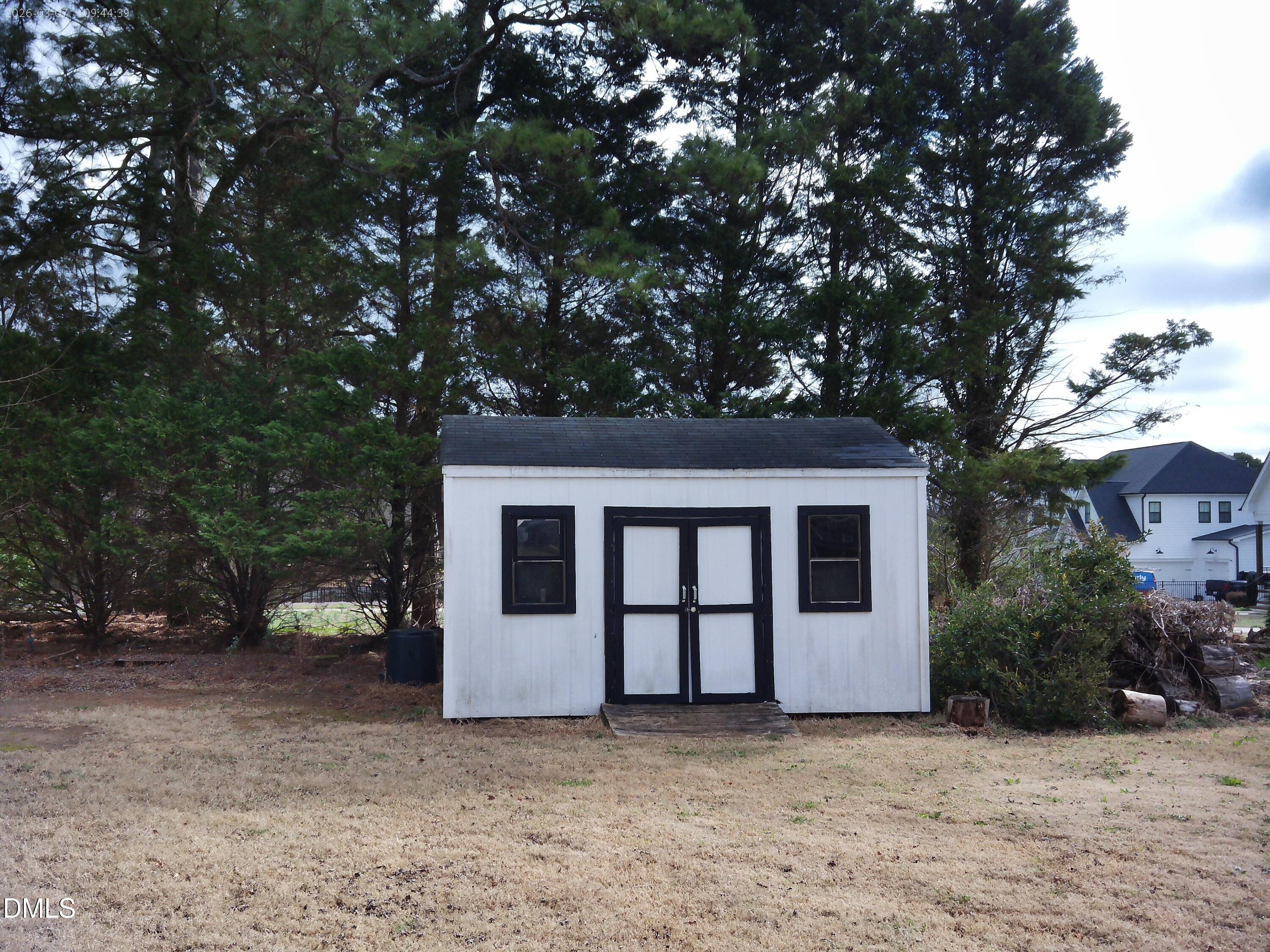 2504 Pennyshire Lane Raleigh, NC 27606 - Photo 30 of 32 a house with trees in front of it
