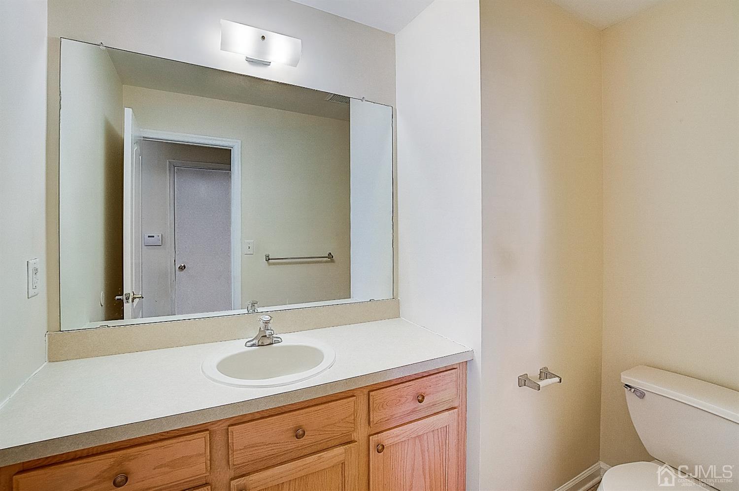 38 Hawthorne Road North Brunswick, NJ 08902 - Photo 11 of 26 a bathroom with a sink and a toilet