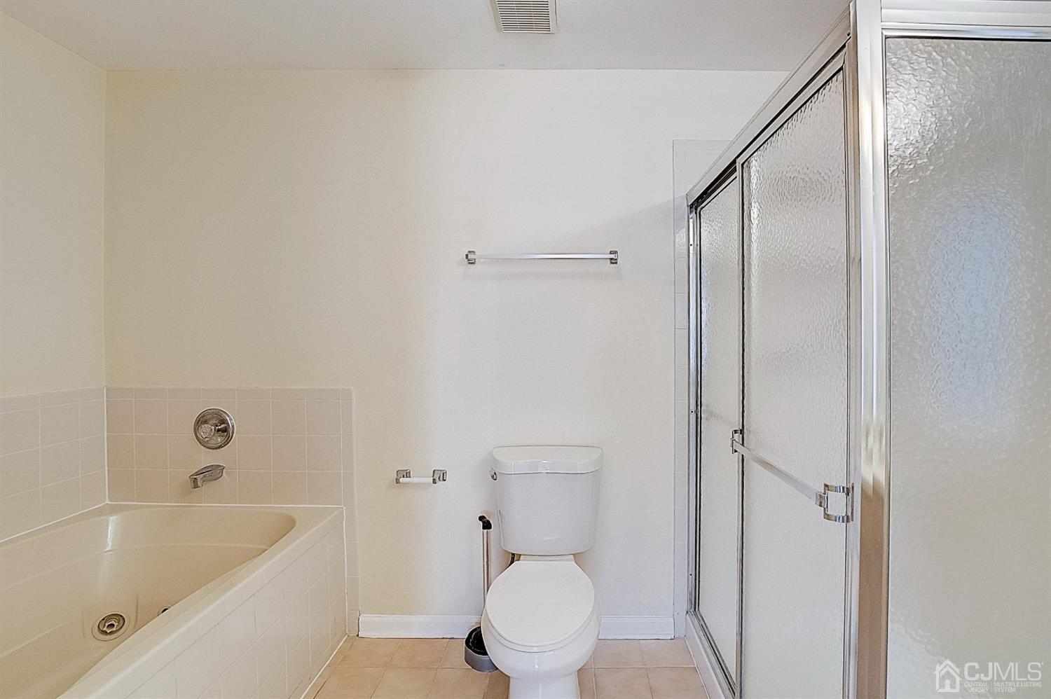 38 Hawthorne Road North Brunswick, NJ 08902 - Photo 15 of 26 a bathroom with a bathtub and a toilet