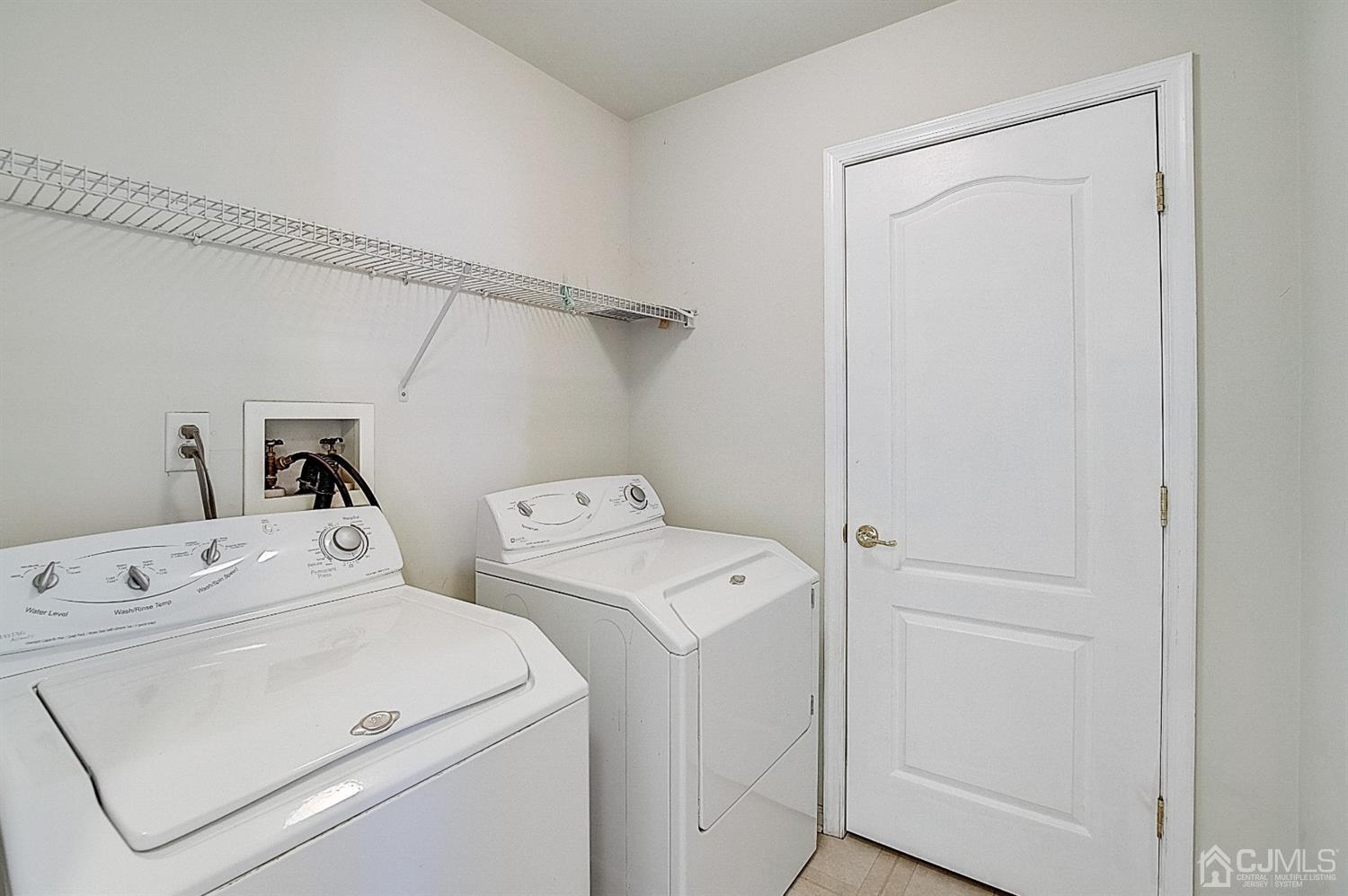 38 Hawthorne Road North Brunswick, NJ 08902 - Photo 16 of 26 a utility room with dryer and washer