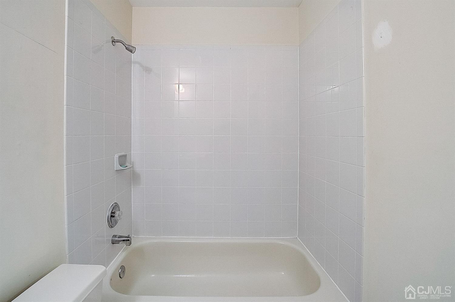 38 Hawthorne Road North Brunswick, NJ 08902 - Photo 20 of 26 a close up of a bathtub