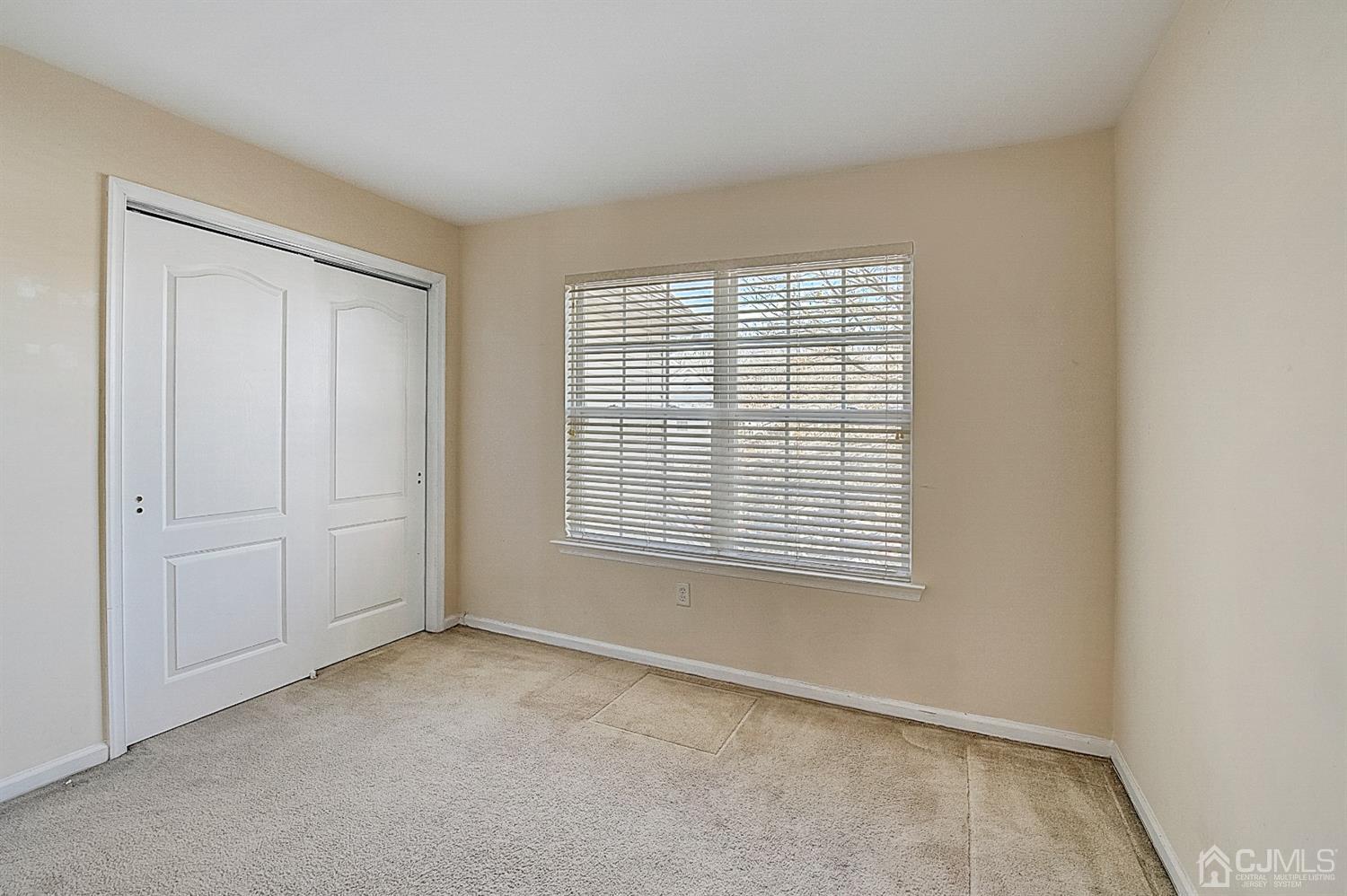 38 Hawthorne Road North Brunswick, NJ 08902 - Photo 21 of 26 a view of an empty room with a window
