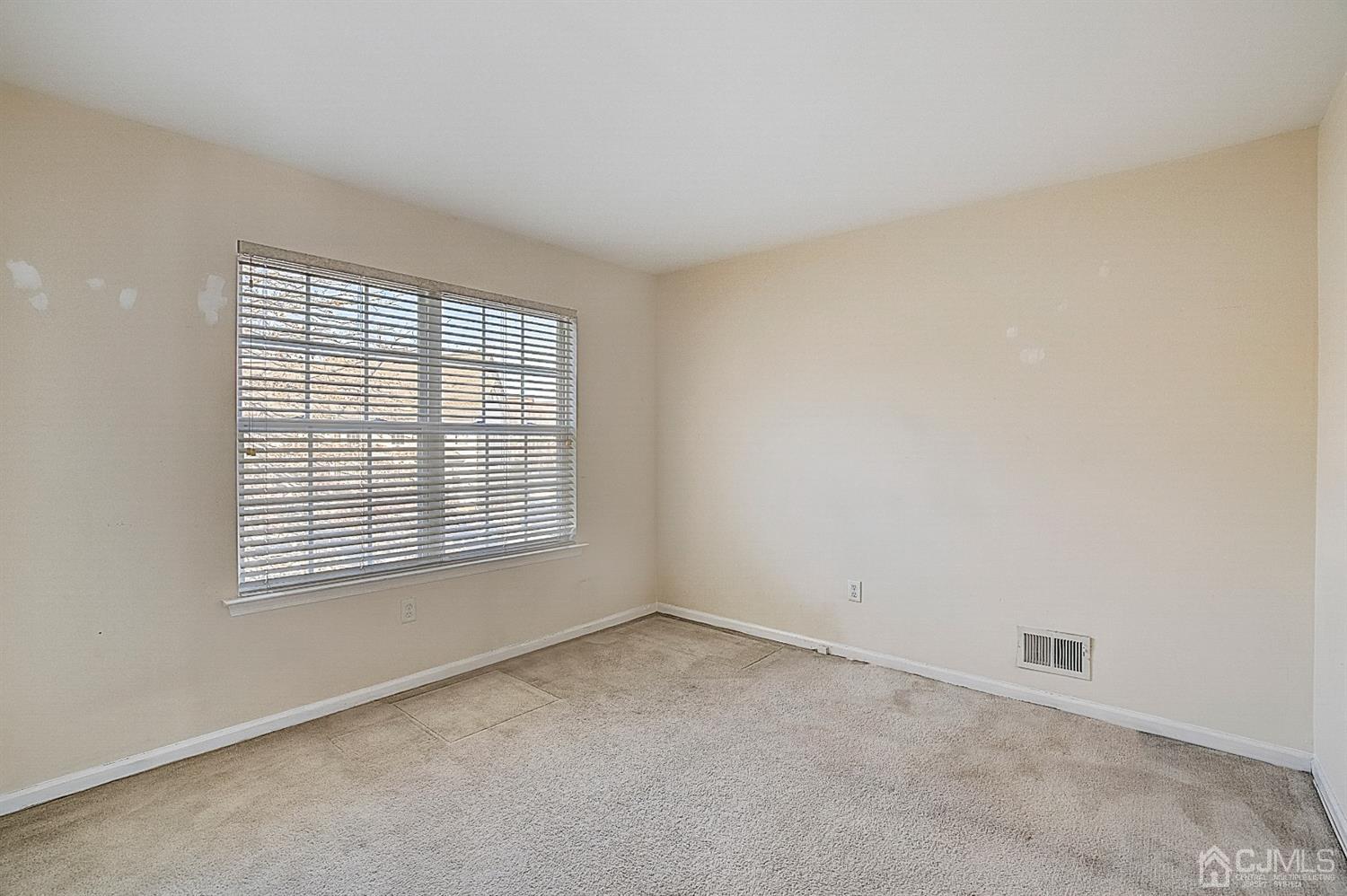 38 Hawthorne Road North Brunswick, NJ 08902 - Photo 22 of 26 an empty room with a window