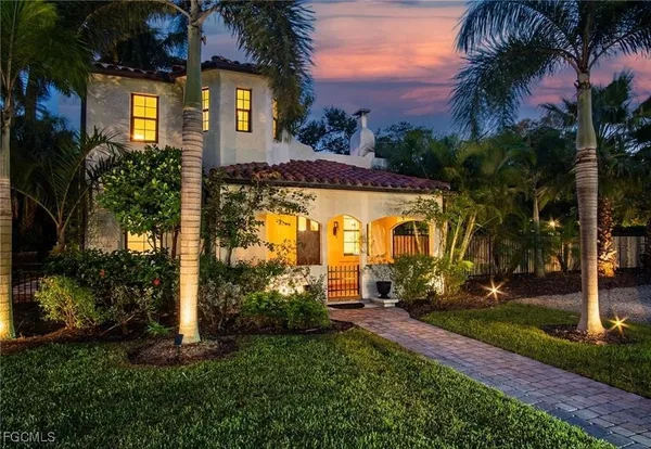 a front view of a house with garden