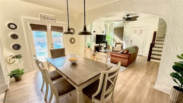 a view of a dining room with furniture and wooden floor