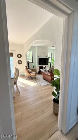 a room with wooden floor and furniture