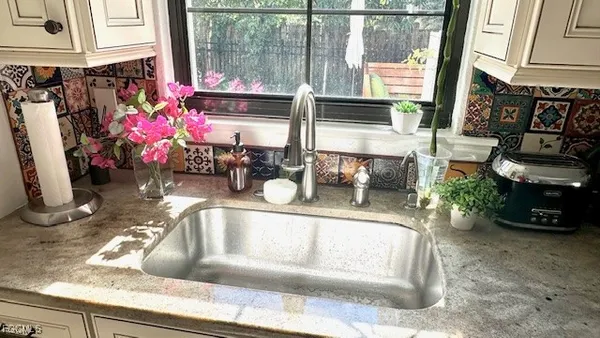 a view of living room with a floor to ceiling window and storage