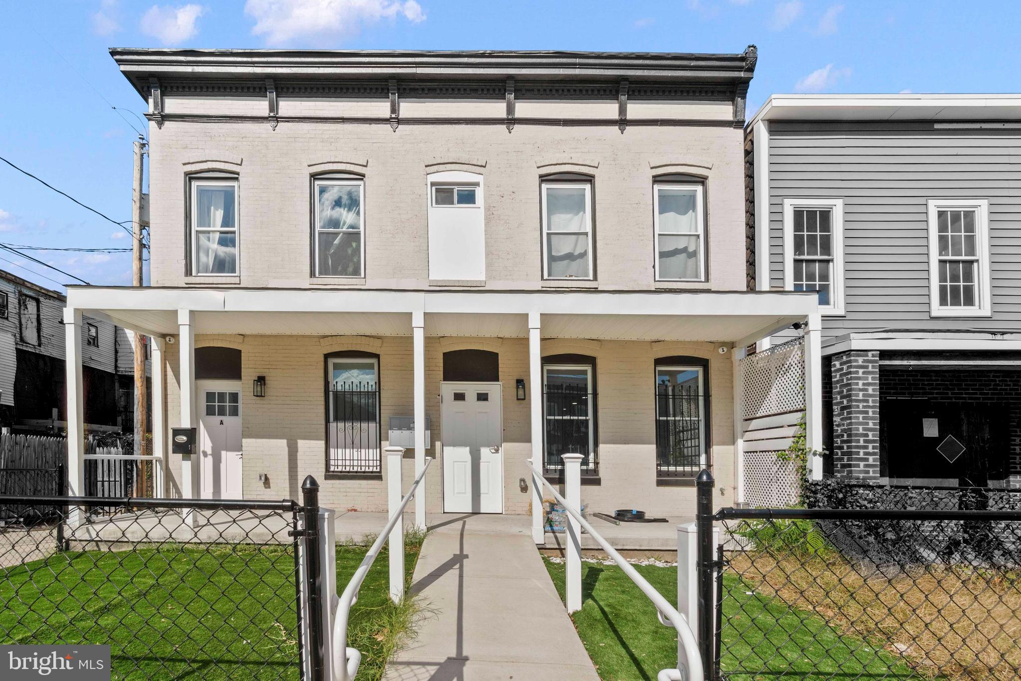 1602 Cypress Street Curtis Bay, MD 21226 - Photo 1 of 42 a front view of a house with garden