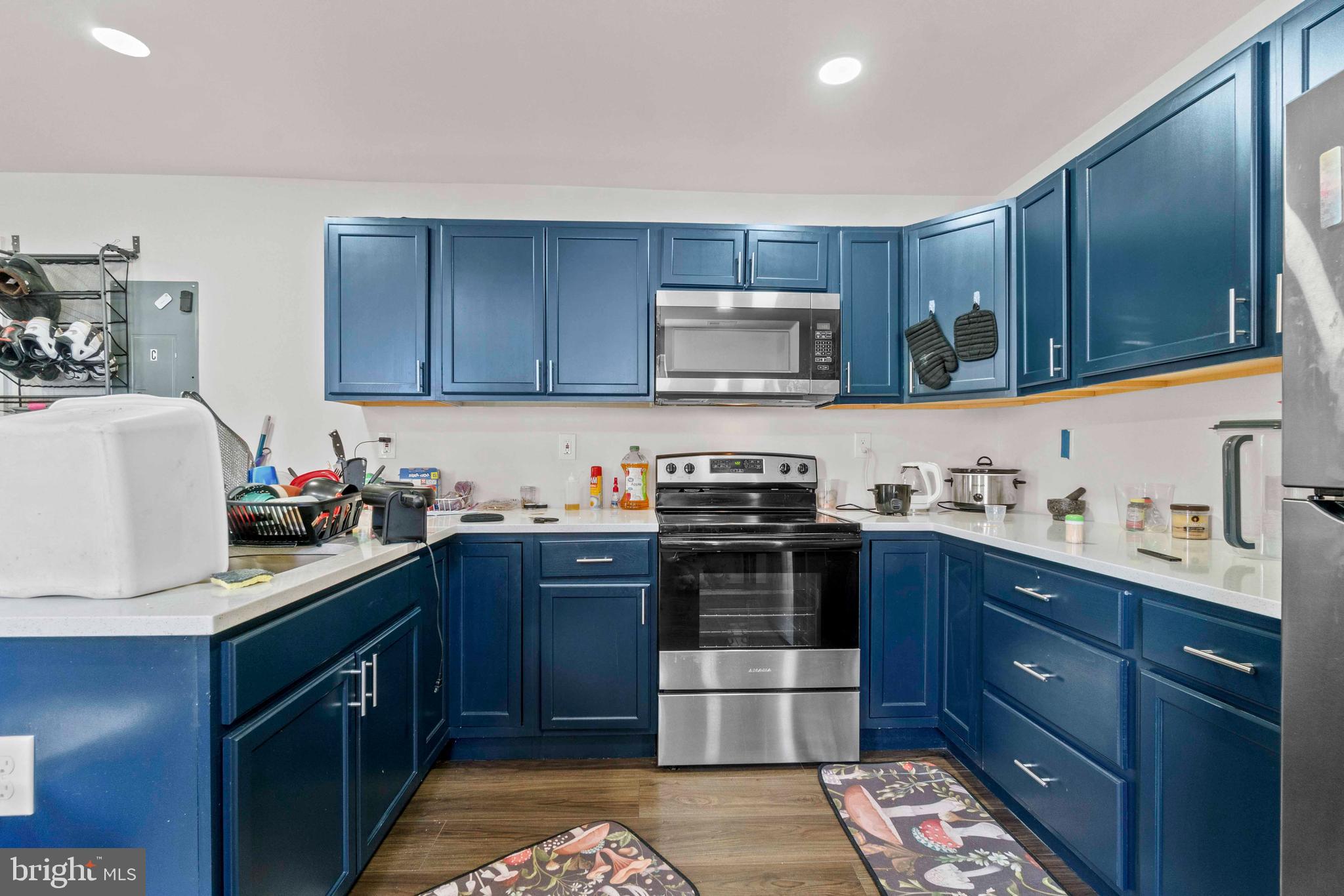 1602 Cypress Street Curtis Bay, MD 21226 - Photo 12 of 42 a kitchen with stainless steel appliances granite countertop a sink stove and microwave