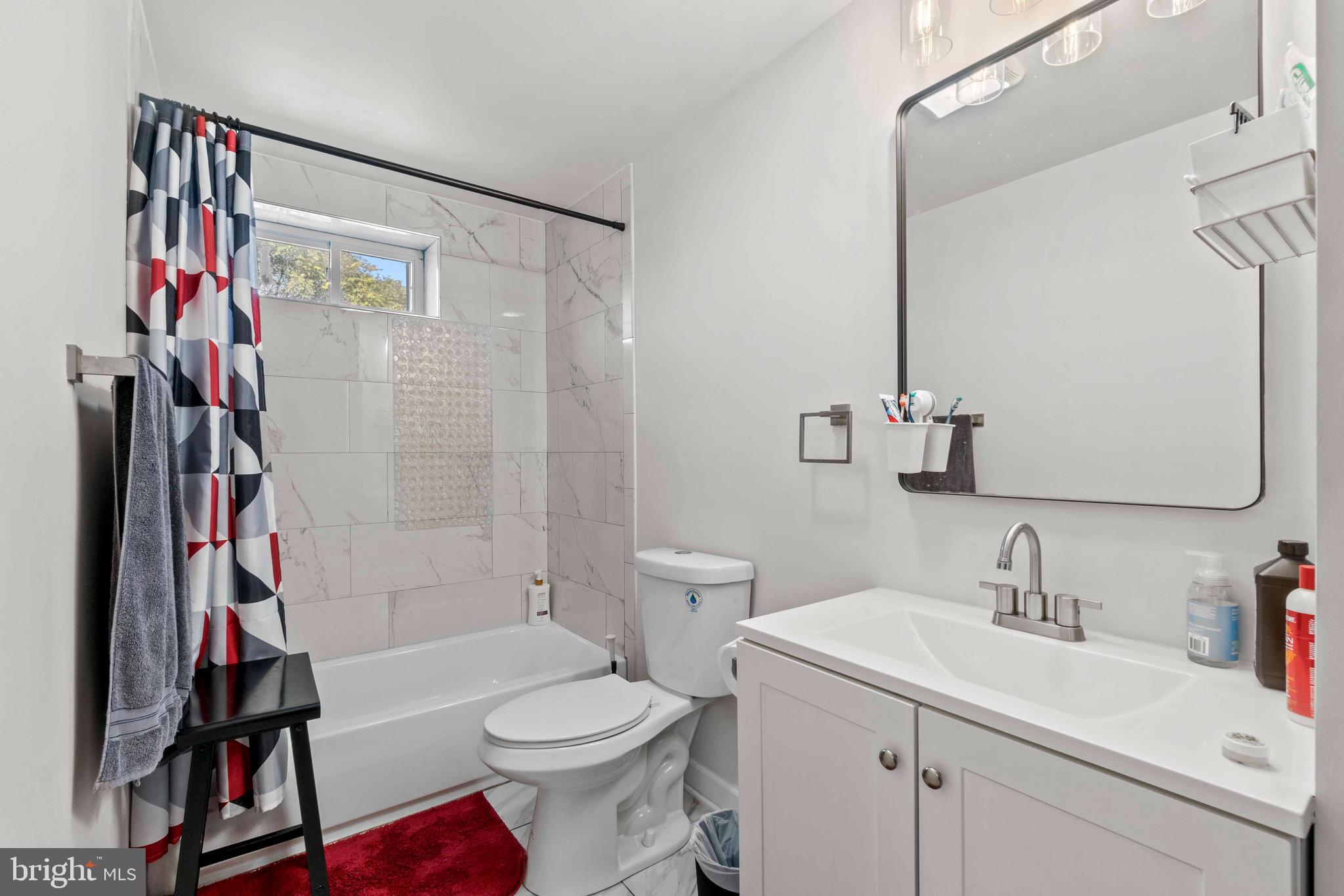 1602 Cypress Street Curtis Bay, MD 21226 - Photo 16 of 42 a bathroom with a sink toilet and shower