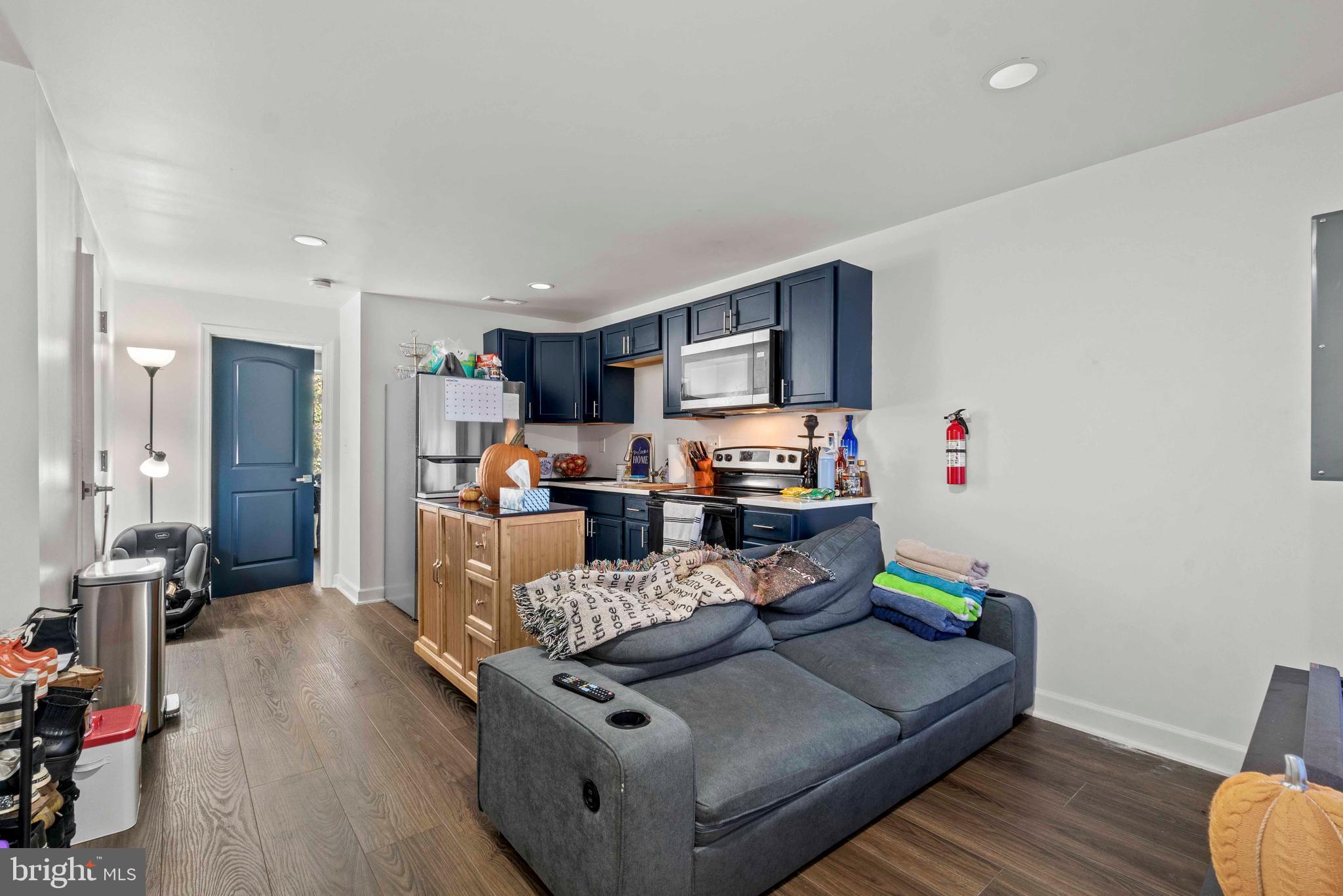 1602 Cypress Street Curtis Bay, MD 21226 - Photo 19 of 42 a living room with furniture and a wooden floor