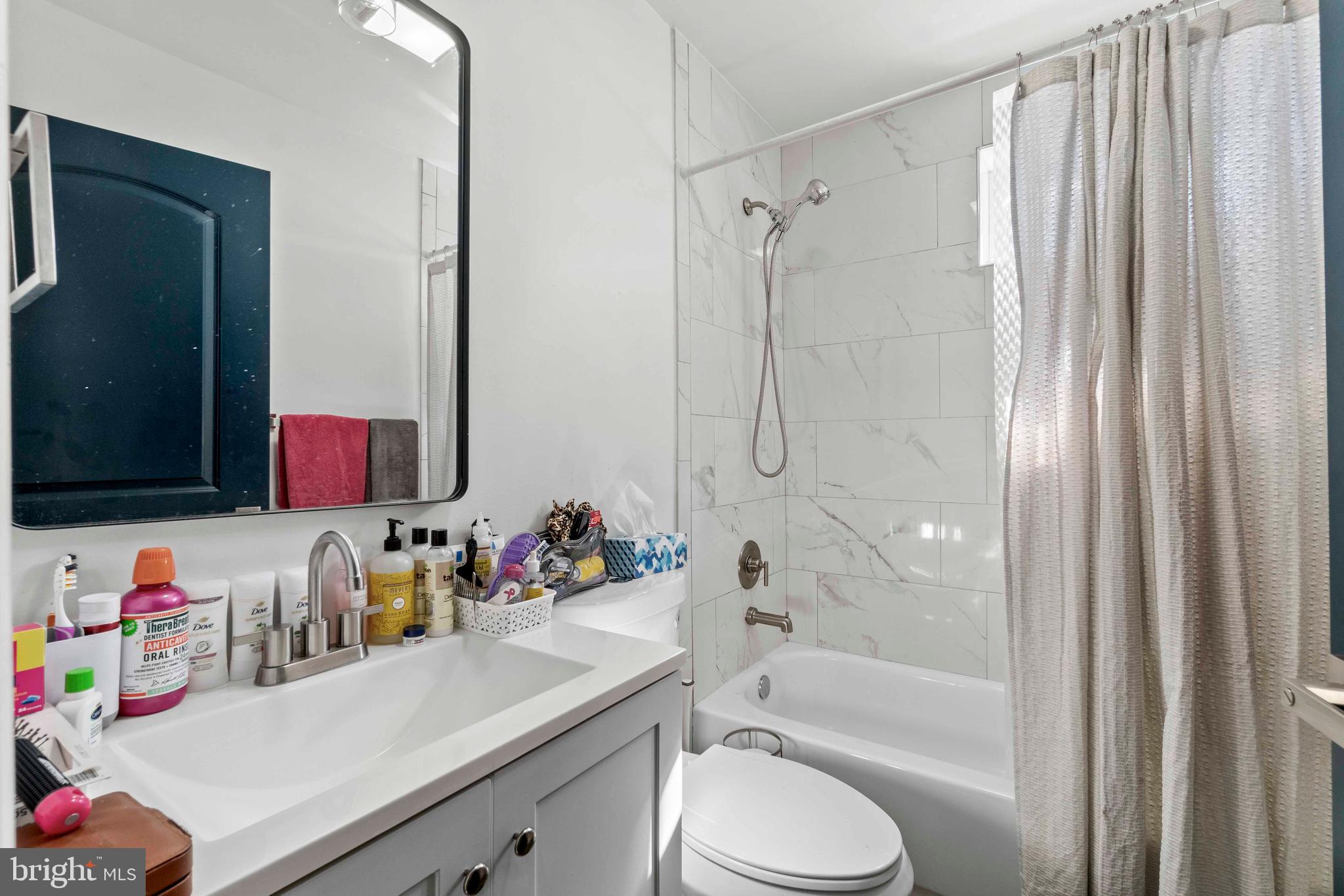 1602 Cypress Street Curtis Bay, MD 21226 - Photo 22 of 42 a bathroom with a sink toilet vanity and shower