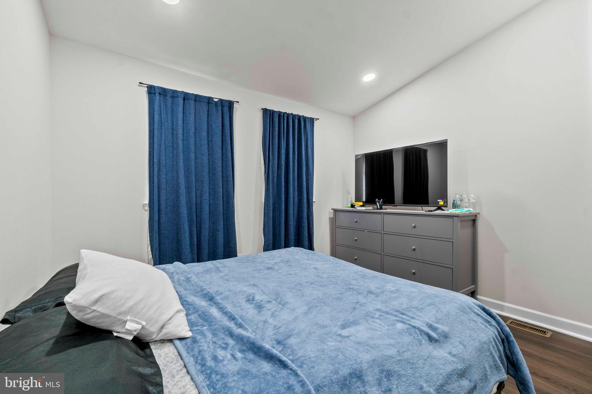 1602 Cypress Street Curtis Bay, MD 21226 - Photo 24 of 42 a bedroom with a bed and a flat screen tv