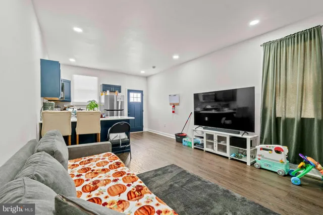 a kitchen with a refrigerator a stove a sink and a refrigerator