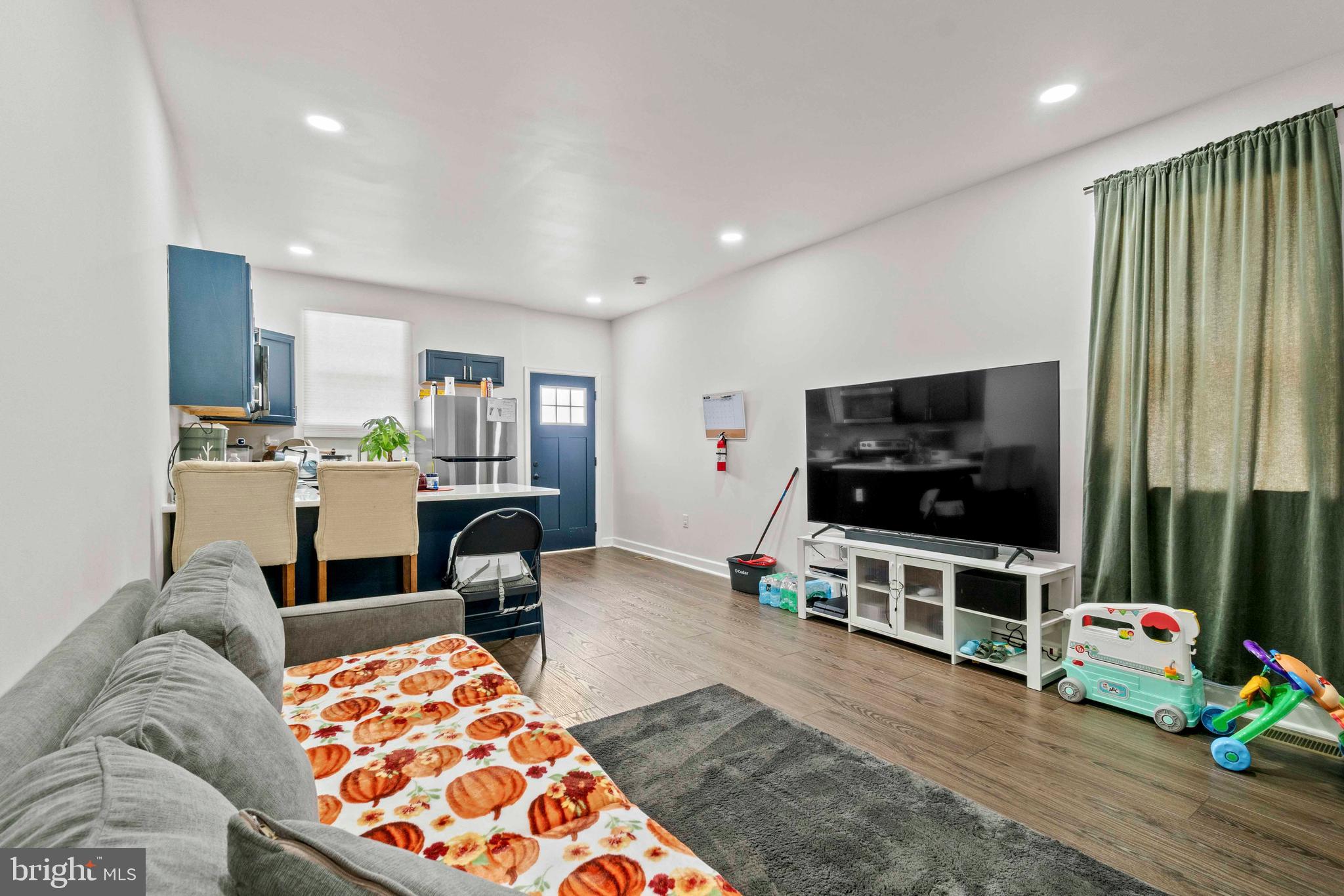 1602 Cypress Street Curtis Bay, MD 21226 - Photo 25 of 42 a living room with furniture and a flat screen tv