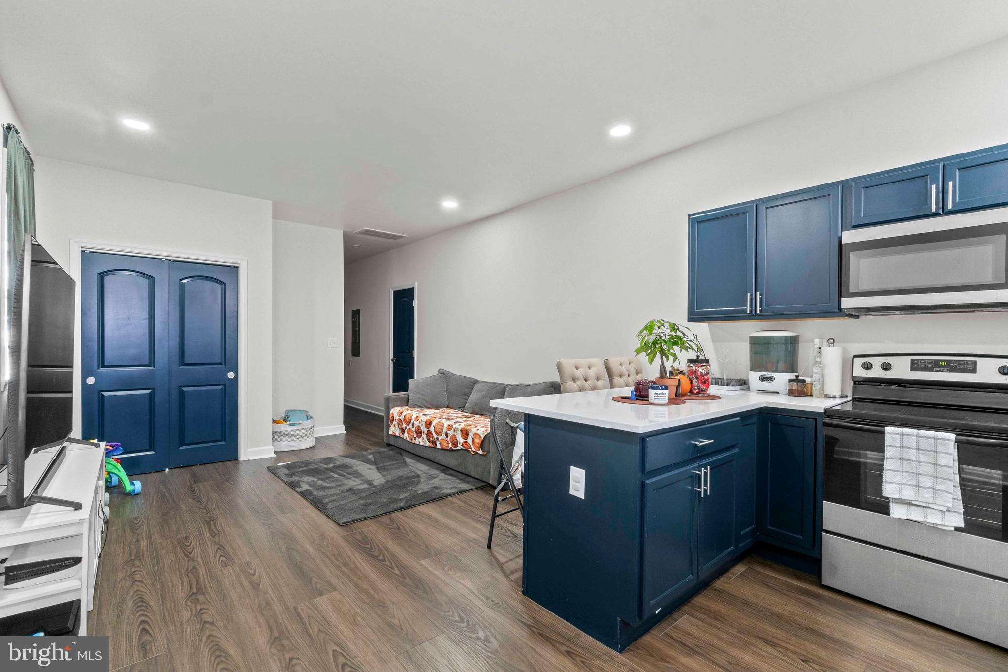 1602 Cypress Street Curtis Bay, MD 21226 - Photo 28 of 42 a kitchen with a stove and a wooden cabinets