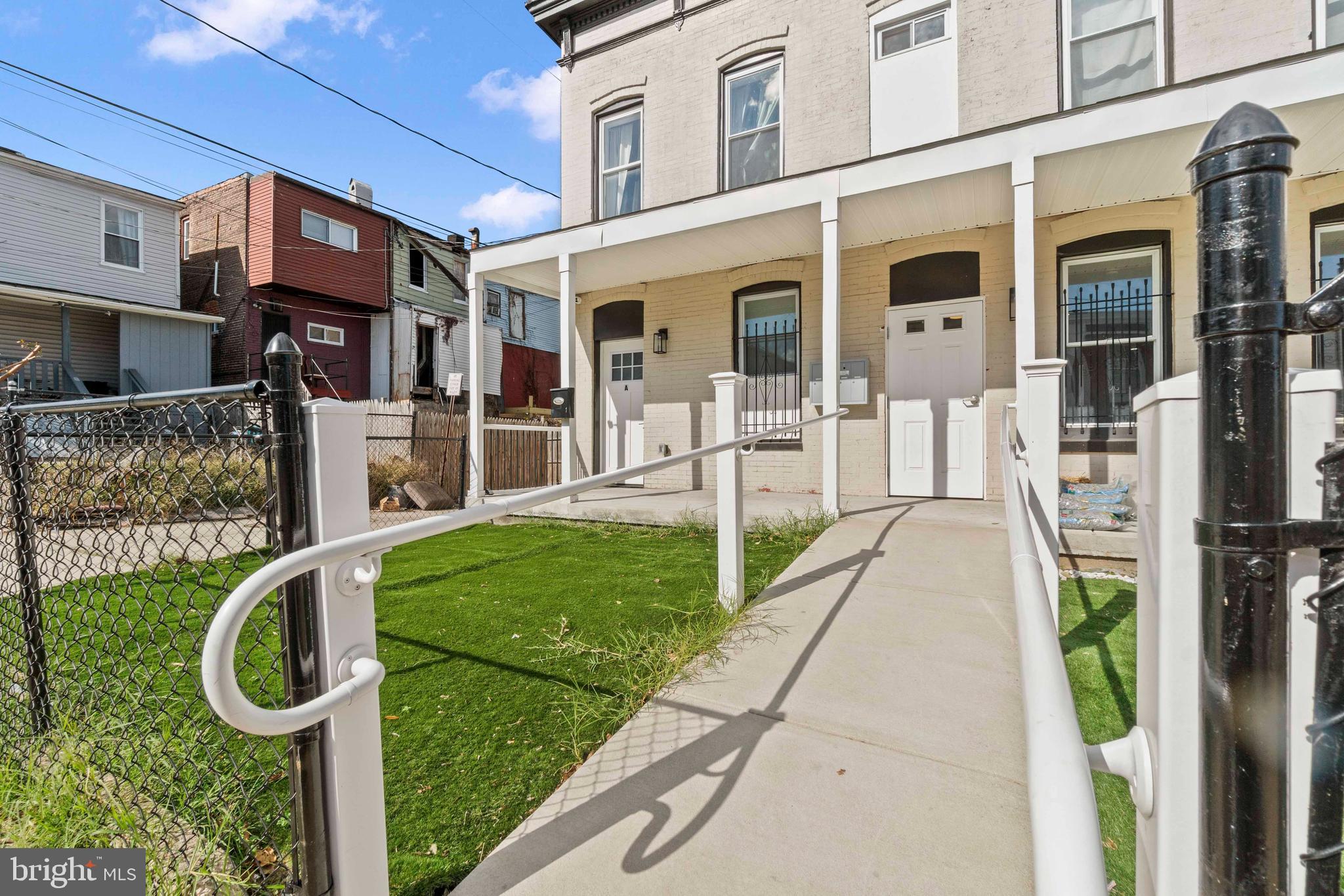 1602 Cypress Street Curtis Bay, MD 21226 - Photo 3 of 42 a view of a house with a yard and pathway