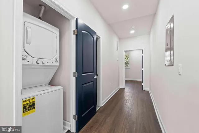 a view of hallway with wooden floor
