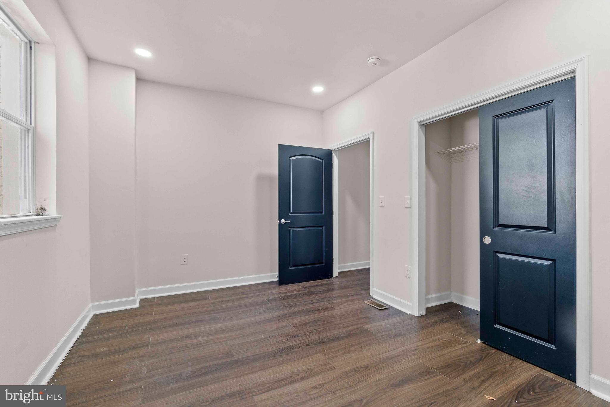 1602 Cypress Street Curtis Bay, MD 21226 - Photo 8 of 42 a view of an empty room with wooden floor and closet