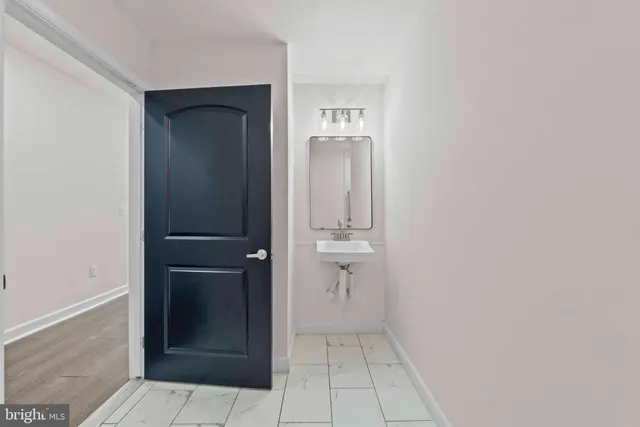 a kitchen with stainless steel appliances kitchen island granite countertop a stove refrigerator and cabinets