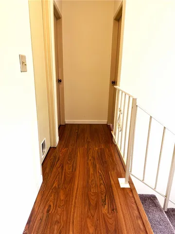 a view of front door with wooden floor