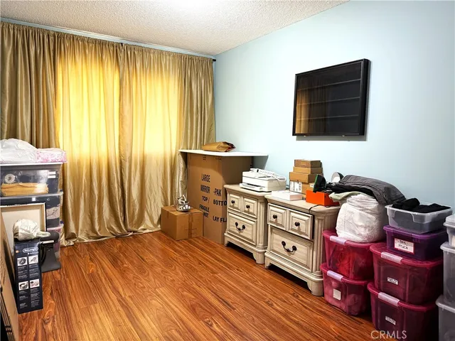 a room with a chair and a flat screen tv