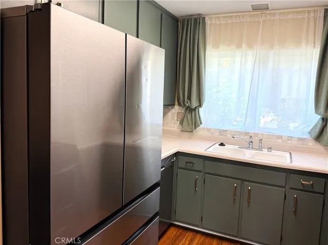 a bathroom with a double vanity sink and mirror
