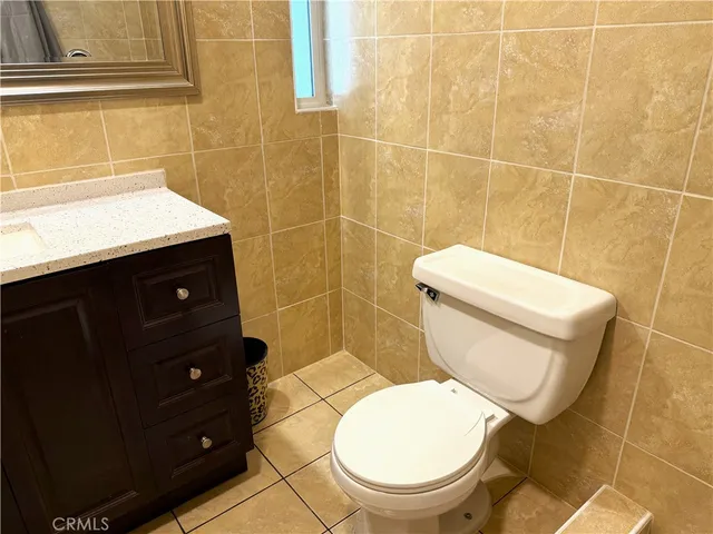 a bathroom with a toilet and a sink